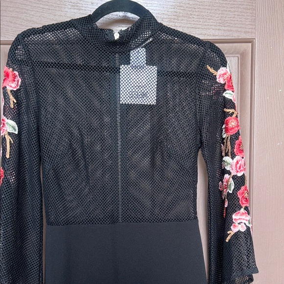 Elegant Black Dress with Floral Accents - Picture 2 of 13